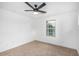 Spacious bedroom with ceiling fan and a window at 7827 W Cypress St, Phoenix, AZ 85035