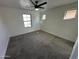 Bright bedroom with two windows and carpet at 7827 W Cypress St, Phoenix, AZ 85035