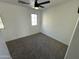 Bright bedroom with ceiling fan and carpet at 7827 W Cypress St, Phoenix, AZ 85035