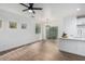 Bright dining area with hardwood floors and modern chandelier at 7827 W Cypress St, Phoenix, AZ 85035