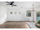 Dining area with wood floors and sliding glass doors at 7827 W Cypress St, Phoenix, AZ 85035