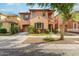 Two-story house with blue shutters and a tree in the front yard at 7827 W Cypress St, Phoenix, AZ 85035