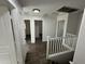 Upstairs hallway with doors to bedrooms at 7827 W Cypress St, Phoenix, AZ 85035