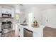 Modern kitchen with stainless steel appliances and white cabinets at 7827 W Cypress St, Phoenix, AZ 85035