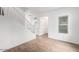 Living room with wood floors, white walls, and a staircase at 7827 W Cypress St, Phoenix, AZ 85035