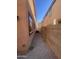 Narrow side yard with gravel and block wall at 7827 W Cypress St, Phoenix, AZ 85035