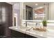 Elegant bathroom with a marble vanity and illuminated mirror at 7870 W Cheryl Dr, Peoria, AZ 85345