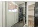 Modern bathroom with a glass-enclosed shower and marble tile at 7870 W Cheryl Dr, Peoria, AZ 85345