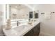 Double vanity bathroom with modern fixtures and a large mirror at 7870 W Cheryl Dr, Peoria, AZ 85345