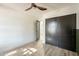 Charming bedroom with dark green wainscoting and ceiling fan at 7870 W Cheryl Dr, Peoria, AZ 85345