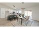 Modern kitchen with island, white cabinets, and breakfast area at 7870 W Cheryl Dr, Peoria, AZ 85345