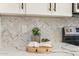 Close up of kitchen backsplash and countertop with herringbone pattern at 7870 W Cheryl Dr, Peoria, AZ 85345