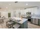 Modern kitchen island with marble countertop and seating for three at 7870 W Cheryl Dr, Peoria, AZ 85345