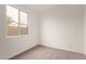 Bedroom with carpet and a window overlooking the neighborhood, providing natural light at 8333 N 54Th Ln, Glendale, AZ 85302