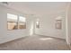 Bright bedroom with carpet, large windows, and neutral paint at 8333 N 54Th Ln, Glendale, AZ 85302