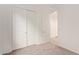 Bedroom featuring sliding closet doors and neutral carpeted floors at 8333 N 54Th Ln, Glendale, AZ 85302