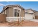 Charming home features a stylish facade, stone accents, and xeriscape landscaping, creating an appealing curb appeal at 8333 N 54Th Ln, Glendale, AZ 85302