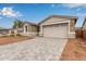 Attractive home with a two-car garage and a stone-accented facade, complemented by tidy landscaping at 8333 N 54Th Ln, Glendale, AZ 85302