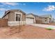 View of an inviting house with stone detailing, two-car garage and xeriscaping at 8333 N 54Th Ln, Glendale, AZ 85302