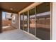 Covered patio featuring a large sliding glass door showcasing the home's indoor-outdoor living at 8333 N 54Th Ln, Glendale, AZ 85302