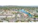 Aerial view of a community with lake and shopping center at 8602 E San Alfredo Dr, Scottsdale, AZ 85258