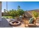 Backyard oasis with fire pit and citrus trees at 8602 E San Alfredo Dr, Scottsdale, AZ 85258