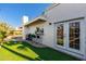 Backyard view showing patio area with seating and a built-in bar at 8602 E San Alfredo Dr, Scottsdale, AZ 85258