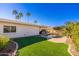 Landscaped backyard with a kidney-shaped pool and patio at 8602 E San Alfredo Dr, Scottsdale, AZ 85258