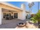 Landscaped backyard with fire pit and patio area at 8602 E San Alfredo Dr, Scottsdale, AZ 85258