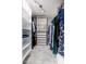 Bright walk-in closet with ample shelving and drawers at 8602 E San Alfredo Dr, Scottsdale, AZ 85258