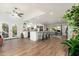 Modern kitchen with white cabinetry, stainless steel appliances, and island seating at 8602 E San Alfredo Dr, Scottsdale, AZ 85258