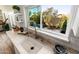 Modern kitchen sink with a sleek faucet and a view of the backyard at 8602 E San Alfredo Dr, Scottsdale, AZ 85258