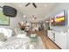 Open living room with light walls, sectional sofa, and view into the kitchen at 8602 E San Alfredo Dr, Scottsdale, AZ 85258