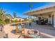 Relaxing pool area with patio furniture and fire pit at 8602 E San Alfredo Dr, Scottsdale, AZ 85258