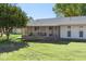 Exterior view of the house with a spacious backyard and patio at 9518 W Shasta Dr, Sun City, AZ 85351