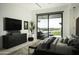 Modern bedroom with large TV and backyard access at 10784 E Pinnacle Peak Rd, Scottsdale, AZ 85255