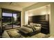 Serene bedroom with a plush bed and backyard access at 10784 E Pinnacle Peak Rd, Scottsdale, AZ 85255