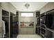 Large walk-in closet, custom shelving, and a window at 10784 E Pinnacle Peak Rd, Scottsdale, AZ 85255