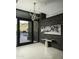 Modern entry with statement art and unique light fixture at 10784 E Pinnacle Peak Rd, Scottsdale, AZ 85255