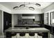 Sleek kitchen with dark cabinetry & marble island at 10784 E Pinnacle Peak Rd, Scottsdale, AZ 85255