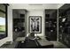 Modern home office with built-in shelving and large windows at 10784 E Pinnacle Peak Rd, Scottsdale, AZ 85255