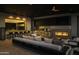 Modern outdoor kitchen with fireplace and seating area at 10784 E Pinnacle Peak Rd, Scottsdale, AZ 85255