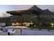 Covered patio with seating and fire pit, mountain views at 10784 E Pinnacle Peak Rd, Scottsdale, AZ 85255