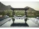 Relaxing pool area with patio furniture and mountain backdrop at 10784 E Pinnacle Peak Rd, Scottsdale, AZ 85255