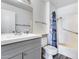 Clean bathroom with gray vanity, shower and bathtub at 10863 W Thunderbird Blvd, Sun City, AZ 85351