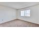 Simple bedroom with carpeted floor and window at 10863 W Thunderbird Blvd, Sun City, AZ 85351