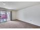 Bedroom with sliding glass door to patio at 10863 W Thunderbird Blvd, Sun City, AZ 85351