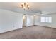 Spacious living room with neutral wall colors and carpet at 10863 W Thunderbird Blvd, Sun City, AZ 85351