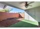 Covered patio with artificial turf and storage shed at 10863 W Thunderbird Blvd, Sun City, AZ 85351