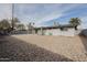 Spacious backyard with gravel and covered patio at 111 E Pebble Beach Dr, Tempe, AZ 85282